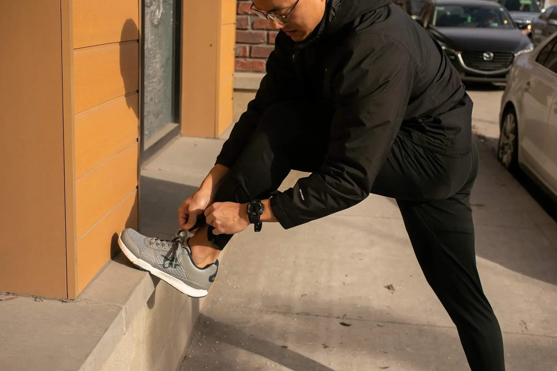 man tying shoe laces