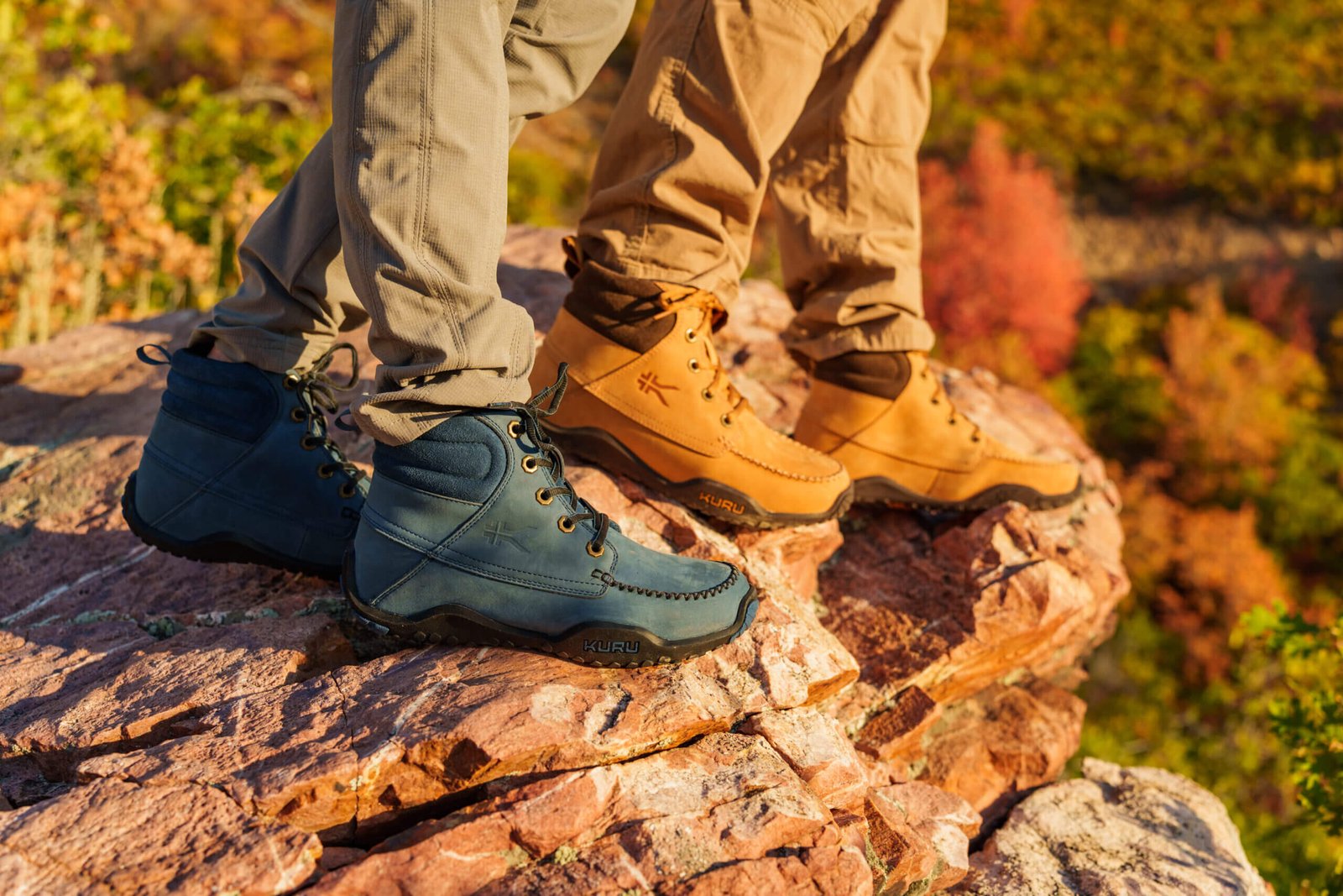 A couple wearing KURU QUEST hiking boots hiking on a fall day.