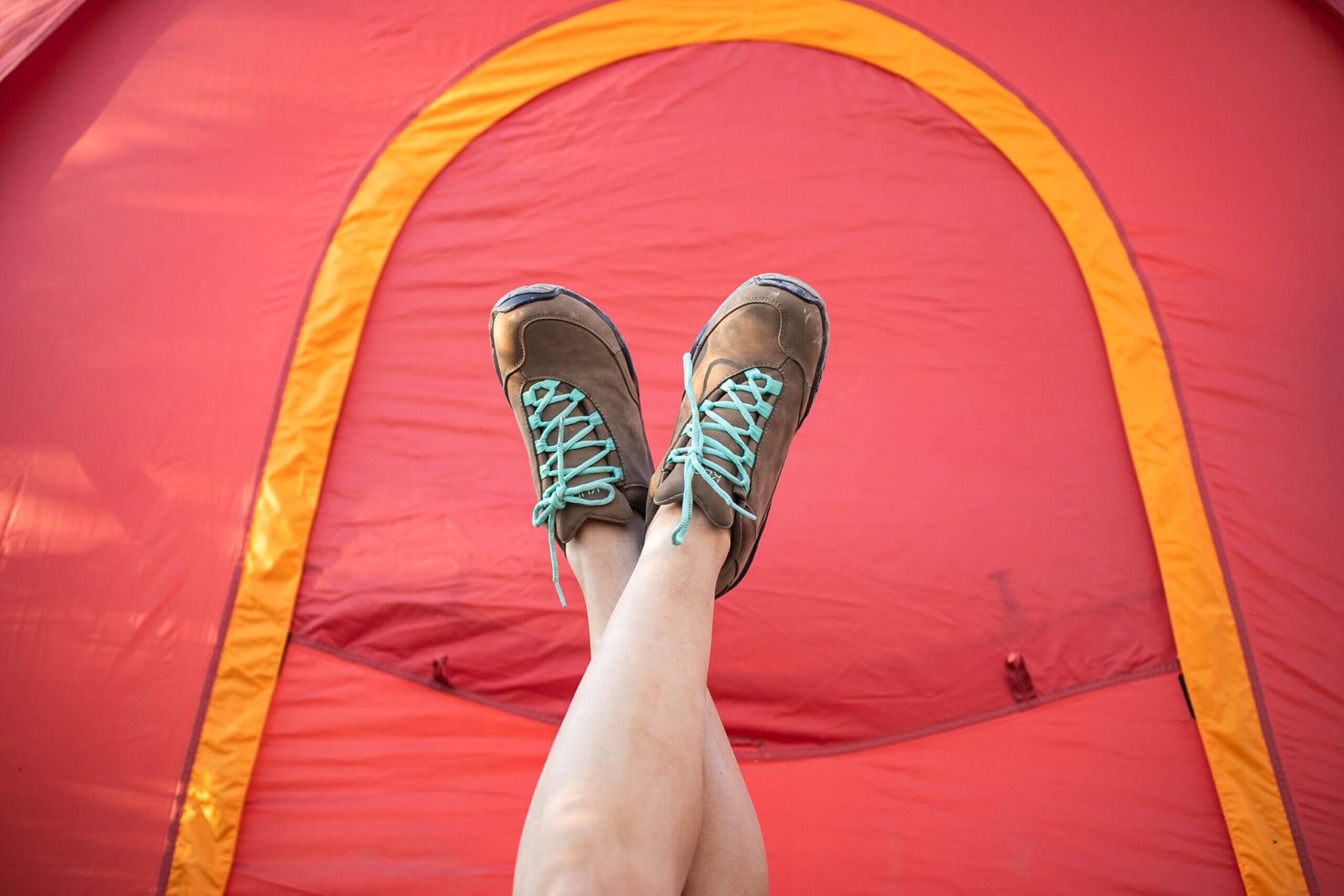 Woman wearing brown KURU CHICANE trail hiking shoes.